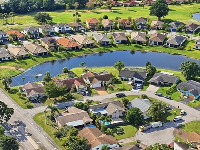 Discover One Of The Premier Locations In Woodmont, Nestled on Woodmont Country Club in Florida - for sale on GolfHomes.com, golf home, golf lot