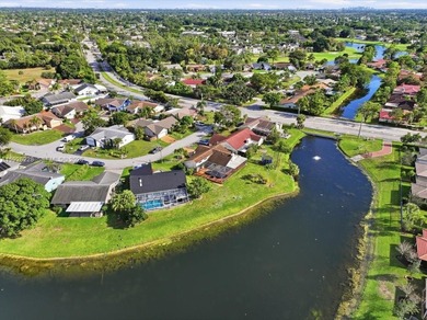 Discover One Of The Premier Locations In Woodmont, Nestled on Woodmont Country Club in Florida - for sale on GolfHomes.com, golf home, golf lot