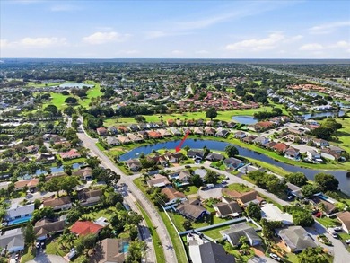 Discover One Of The Premier Locations In Woodmont, Nestled on Woodmont Country Club in Florida - for sale on GolfHomes.com, golf home, golf lot