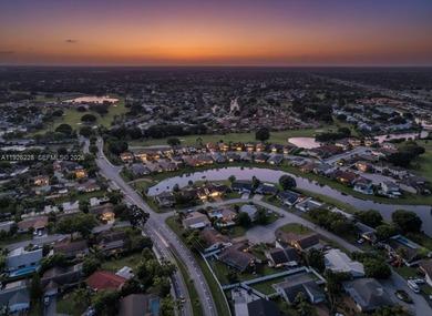 Discover One Of The Premier Locations In Woodmont, Nestled on Woodmont Country Club in Florida - for sale on GolfHomes.com, golf home, golf lot