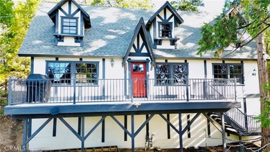 Nestled beneath towering pine trees, this charming 3-bedroom on Lake Arrowhead Country Club in California - for sale on GolfHomes.com, golf home, golf lot