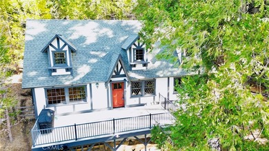 Nestled beneath towering pine trees, this charming 3-bedroom on Lake Arrowhead Country Club in California - for sale on GolfHomes.com, golf home, golf lot