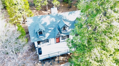 Nestled beneath towering pine trees, this charming 3-bedroom on Lake Arrowhead Country Club in California - for sale on GolfHomes.com, golf home, golf lot