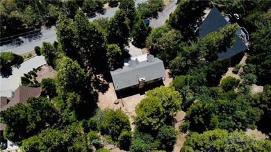 Nestled beneath towering pine trees, this charming 3-bedroom on Lake Arrowhead Country Club in California - for sale on GolfHomes.com, golf home, golf lot