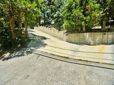 Nestled beneath towering pine trees, this charming 3-bedroom on Lake Arrowhead Country Club in California - for sale on GolfHomes.com, golf home, golf lot