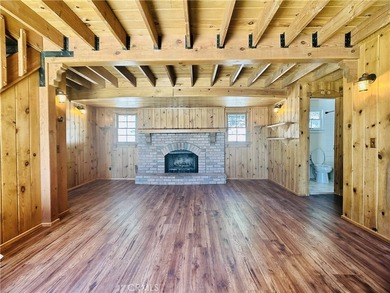 Nestled beneath towering pine trees, this charming 3-bedroom on Lake Arrowhead Country Club in California - for sale on GolfHomes.com, golf home, golf lot