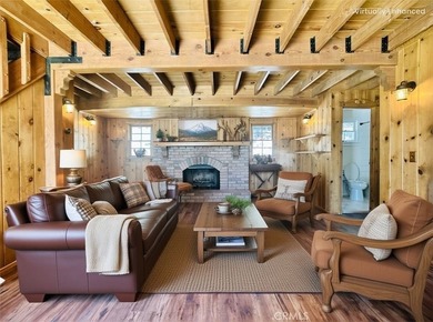 Nestled beneath towering pine trees, this charming 3-bedroom on Lake Arrowhead Country Club in California - for sale on GolfHomes.com, golf home, golf lot