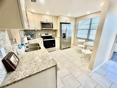 REDUCED FOR QUICK SALE!! Top-Floor Serenity Meets Resort-Style on Wynmoor Golf Course in Florida - for sale on GolfHomes.com, golf home, golf lot