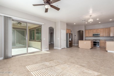 Gated community living at its best! This 4-bedroom, 2-bath home on Palm Valley Golf Club  in Arizona - for sale on GolfHomes.com, golf home, golf lot