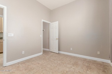 Gated community living at its best! This 4-bedroom, 2-bath home on Palm Valley Golf Club  in Arizona - for sale on GolfHomes.com, golf home, golf lot