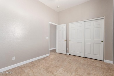 Gated community living at its best! This 4-bedroom, 2-bath home on Palm Valley Golf Club  in Arizona - for sale on GolfHomes.com, golf home, golf lot