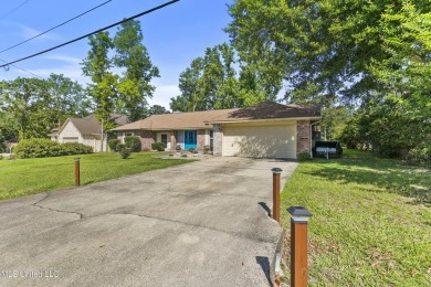 Move-in ready home in the highly sought-after Diamondhead golf on Diamondhead Country Club in Mississippi - for sale on GolfHomes.com, golf home, golf lot