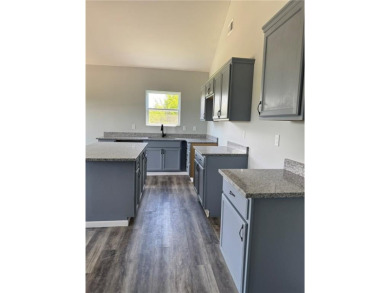 This stunning, brand new ranch home, boasting 3 bedrooms and 2 on Linn Valley Lakes - Deer Trace Golf Course in Kansas - for sale on GolfHomes.com, golf home, golf lot