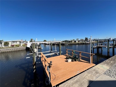 Affordable Saltwater Canal Waterfront Living with 40ft seawall on Mangrove Bay Golf Course in Florida - for sale on GolfHomes.com, golf home, golf lot