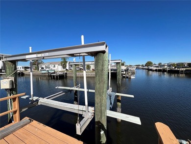 Affordable Saltwater Canal Waterfront Living with 40ft seawall on Mangrove Bay Golf Course in Florida - for sale on GolfHomes.com, golf home, golf lot