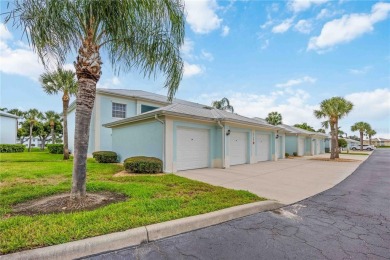 Enjoy waterfront living in this turnkey bright end-unit villa on Sabal Trace Golf and Country Club in Florida - for sale on GolfHomes.com, golf home, golf lot