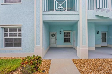 Enjoy waterfront living in this turnkey bright end-unit villa on Sabal Trace Golf and Country Club in Florida - for sale on GolfHomes.com, golf home, golf lot