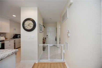 Enjoy waterfront living in this turnkey bright end-unit villa on Sabal Trace Golf and Country Club in Florida - for sale on GolfHomes.com, golf home, golf lot