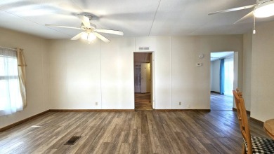 Welcome to your perfect retirement oasis in the charming city of on Herons Glen Golf and Country Club in Florida - for sale on GolfHomes.com, golf home, golf lot