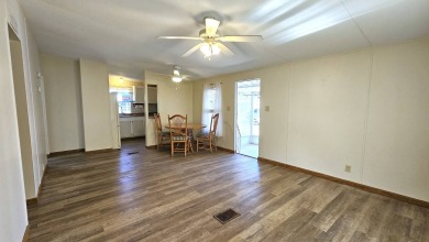 Welcome to your perfect retirement oasis in the charming city of on Herons Glen Golf and Country Club in Florida - for sale on GolfHomes.com, golf home, golf lot