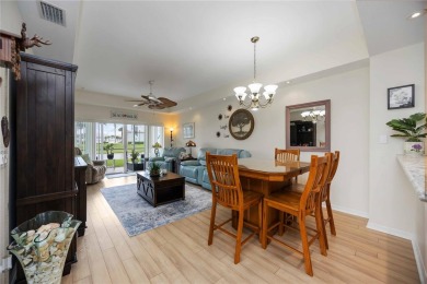 Enjoy waterfront living in this turnkey bright end-unit villa on Sabal Trace Golf and Country Club in Florida - for sale on GolfHomes.com, golf home, golf lot