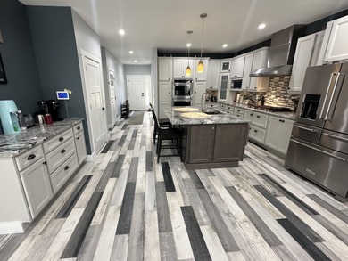 This home overlooks the pristine Lake Michigan Hills Golf Course on Lake Michigan Hills Golf Club in Michigan - for sale on GolfHomes.com, golf home, golf lot