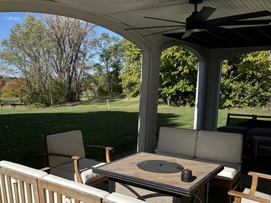 This home overlooks the pristine Lake Michigan Hills Golf Course on Lake Michigan Hills Golf Club in Michigan - for sale on GolfHomes.com, golf home, golf lot