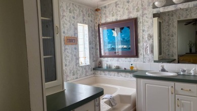 Discover your dream home! This stunning 3-bedroom, 2-bath oasis on Sabal Springs Golf and Racquet Club in Florida - for sale on GolfHomes.com, golf home, golf lot