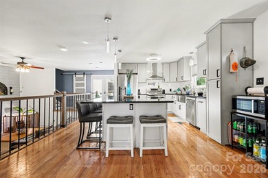 This charming split-level home offers a welcoming blend of on Tega Cay Golf Club in South Carolina - for sale on GolfHomes.com, golf home, golf lot