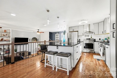 This charming split-level home offers a welcoming blend of on Tega Cay Golf Club in South Carolina - for sale on GolfHomes.com, golf home, golf lot