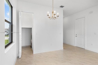 Built in 2024 and impeccably maintained, this stunning 3-bedroom on Panther Run Golf Club in Florida - for sale on GolfHomes.com, golf home, golf lot