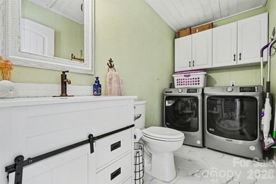 This charming split-level home offers a welcoming blend of on Tega Cay Golf Club in South Carolina - for sale on GolfHomes.com, golf home, golf lot