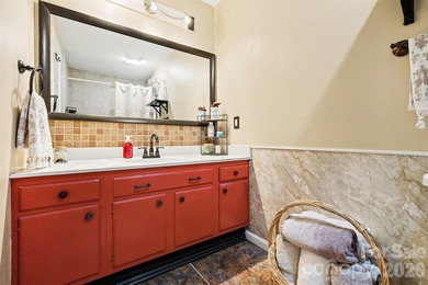 This charming split-level home offers a welcoming blend of on Tega Cay Golf Club in South Carolina - for sale on GolfHomes.com, golf home, golf lot