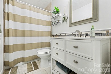 This charming split-level home offers a welcoming blend of on Tega Cay Golf Club in South Carolina - for sale on GolfHomes.com, golf home, golf lot