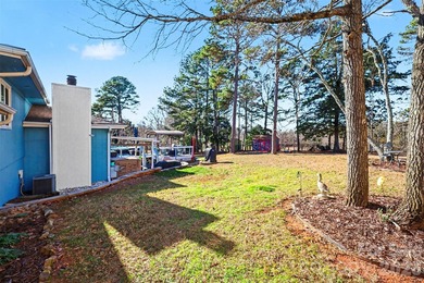 This charming split-level home offers a welcoming blend of on Tega Cay Golf Club in South Carolina - for sale on GolfHomes.com, golf home, golf lot
