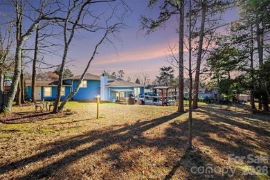 This charming split-level home offers a welcoming blend of on Tega Cay Golf Club in South Carolina - for sale on GolfHomes.com, golf home, golf lot