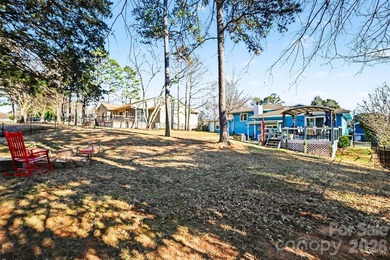 This charming split-level home offers a welcoming blend of on Tega Cay Golf Club in South Carolina - for sale on GolfHomes.com, golf home, golf lot