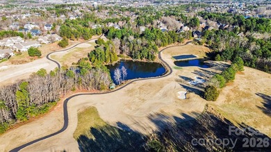This charming split-level home offers a welcoming blend of on Tega Cay Golf Club in South Carolina - for sale on GolfHomes.com, golf home, golf lot