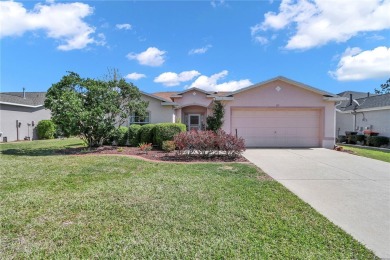 Nestled in an active 55+ community, this 3-bedroom, 2-bath home on Summerglen Country Club in Florida - for sale on GolfHomes.com, golf home, golf lot