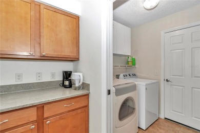 Nestled in an active 55+ community, this 3-bedroom, 2-bath home on Summerglen Country Club in Florida - for sale on GolfHomes.com, golf home, golf lot