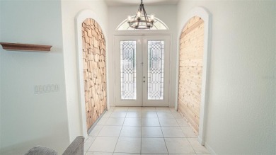 This stunning,  4-bedroom, 3-bathroom pool home boasts a light on Wedgefield Golf Club in Florida - for sale on GolfHomes.com, golf home, golf lot