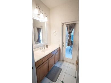 This stunning,  4-bedroom, 3-bathroom pool home boasts a light on Wedgefield Golf Club in Florida - for sale on GolfHomes.com, golf home, golf lot