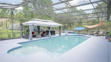 This stunning,  4-bedroom, 3-bathroom pool home boasts a light on Wedgefield Golf Club in Florida - for sale on GolfHomes.com, golf home, golf lot