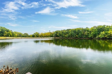 Nestled along the tranquil shores of a pristine lake, this on Carlinville Country Club in Illinois - for sale on GolfHomes.com, golf home, golf lot