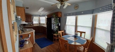 Come settle down and relax in a beautiful manufactured home with on Fairways Country Club in Florida - for sale on GolfHomes.com, golf home, golf lot