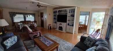 Come settle down and relax in a beautiful manufactured home with on Fairways Country Club in Florida - for sale on GolfHomes.com, golf home, golf lot
