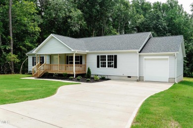 The home is located on an almost 1/2 acre lot at Lake Royale on River Golf and County Club at Lake Royale in North Carolina - for sale on GolfHomes.com, golf home, golf lot