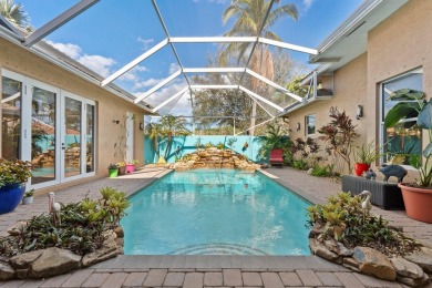 Welcome to this exquisite custom-built courtyard home, perfectly on The Cape Club of Palm City in Florida - for sale on GolfHomes.com, golf home, golf lot