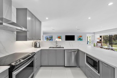 Welcome to this beautifully updated second-floor residence on Quail Ridge Golf Course and Country Club in Florida - for sale on GolfHomes.com, golf home, golf lot