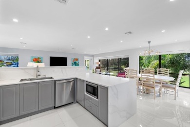Welcome to this beautifully updated second-floor residence on Quail Ridge Golf Course and Country Club in Florida - for sale on GolfHomes.com, golf home, golf lot